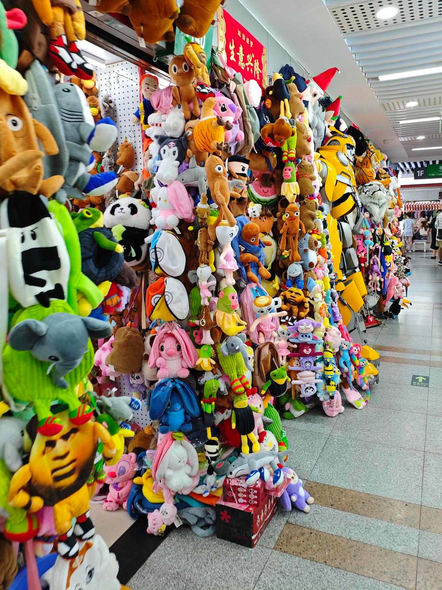 Wholesale plush toys on display at a toy stall in Yiwu International Trade City District 1, a key stop for toy sourcing buyers