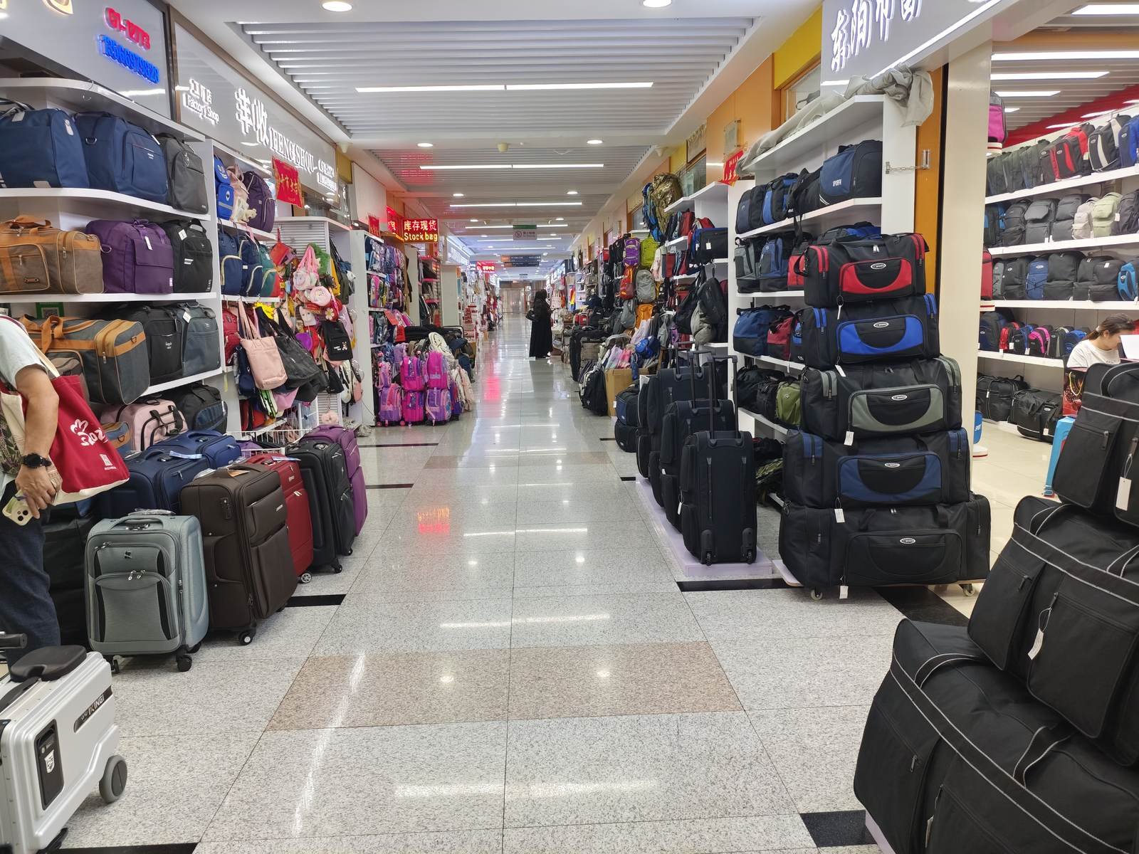 Busy Yiwu Futian market booth filled with various wholesale spot‑stock products